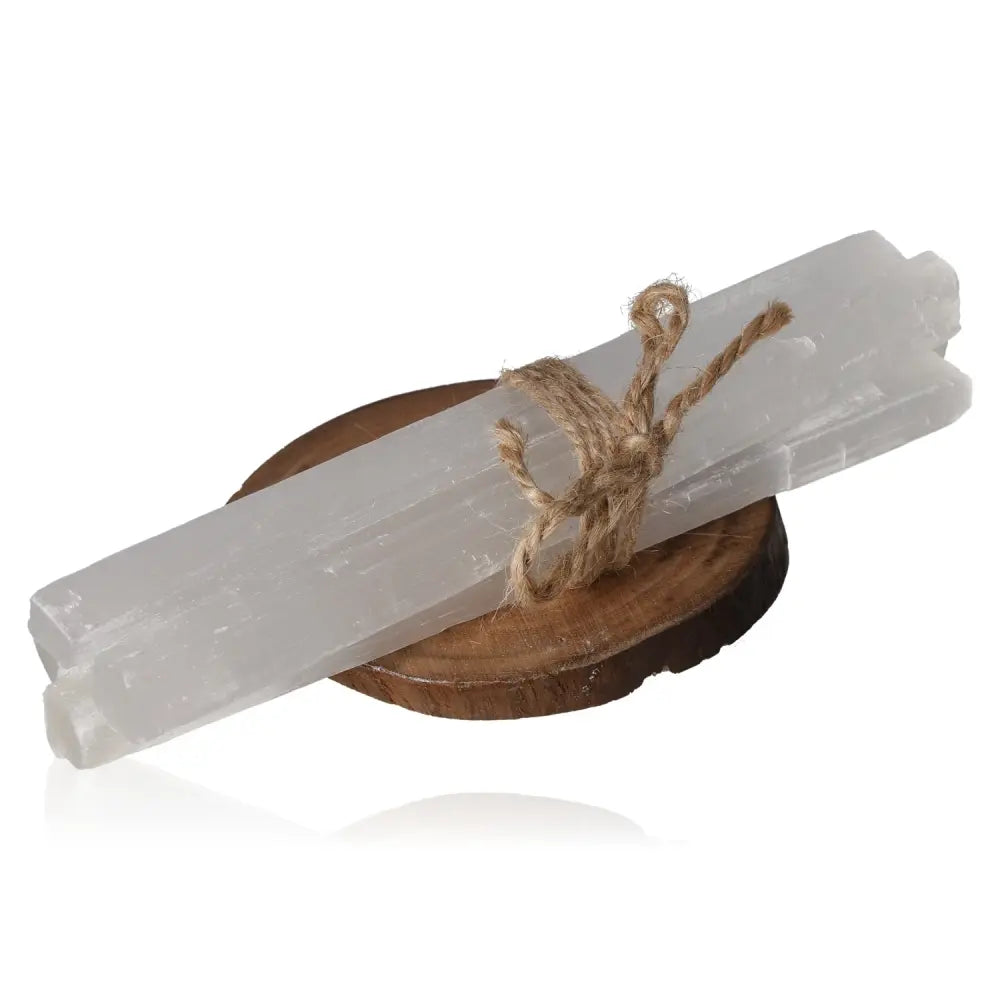 20cm selenite rough pack with silky glass-like transparency, tied with twine, on round wooden base, for purifying energy and serenity.