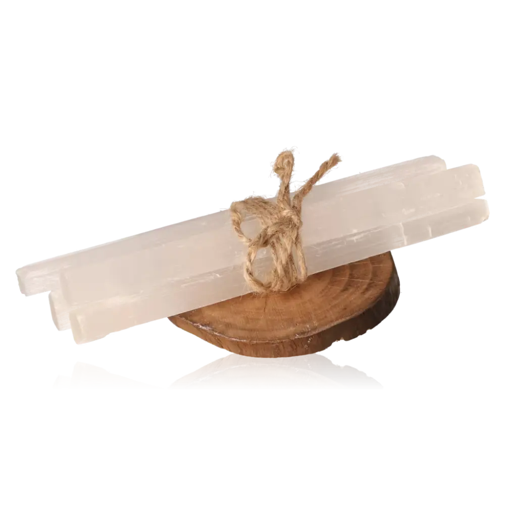 Set of rough selenite sticks tied with twine on a wooden stand, showcasing the mineral's glass-like transparency and natural striations.