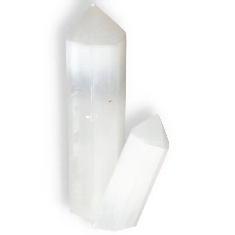 Two Selennite points by Sylvia Crystals for spiritual growth and mindfulness, showcasing premium-quality, ethically-sourced selenite.