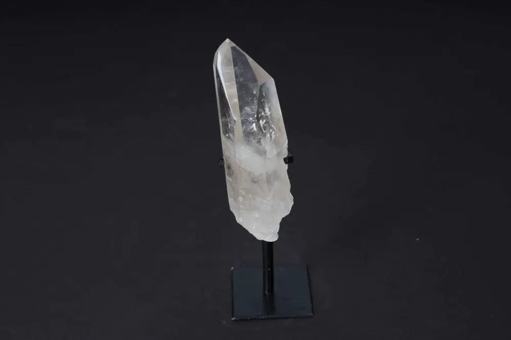Semi Polished Clear Quartz Point on Stand, perfect for meditation and energy work. Amplifies clarity and intention in any space.