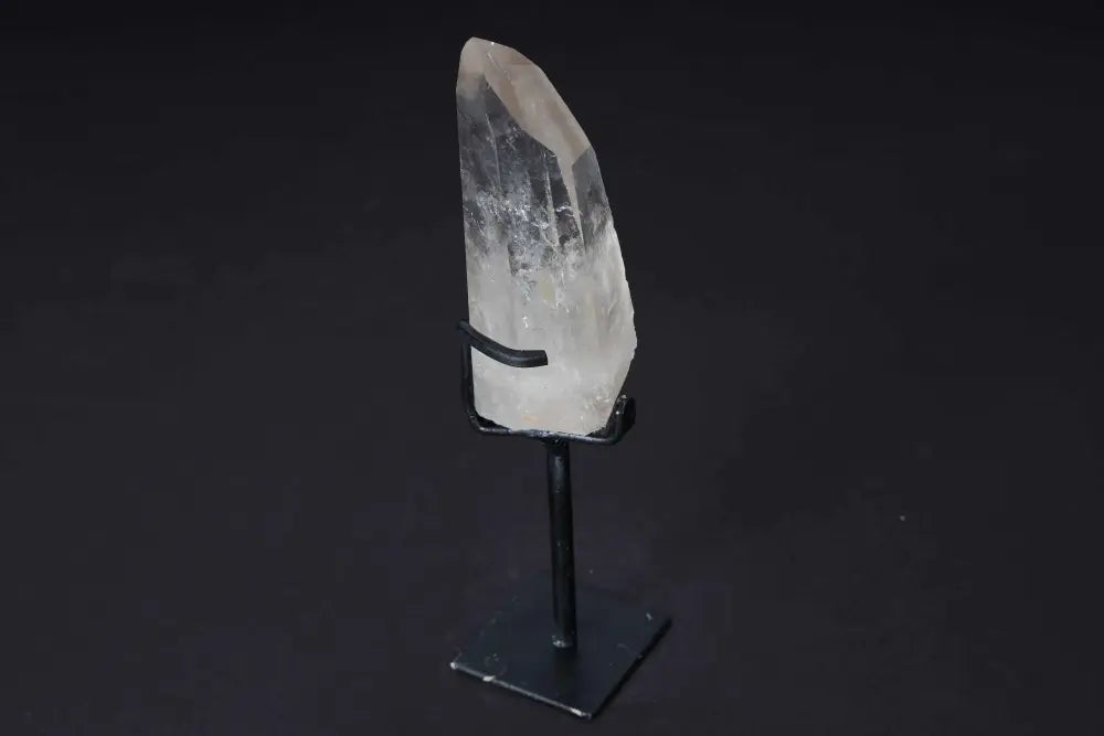 Semi polished clear quartz point on a modern stand, perfect for meditation, manifestation, and amplifying clarity and energy.