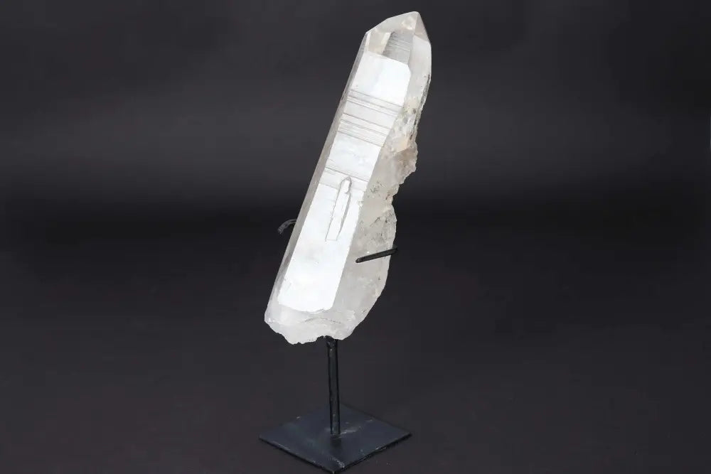 Semi Polished Clear Quartz Point on Stand, ideal for meditation, manifestation, and amplifying energy, displayed elegantly.
