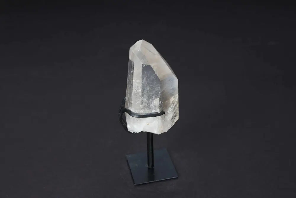 Semi-Polished Smoky Quartz Point on Stand, showcasing natural and polished surfaces for grounding and protective energy as decor.