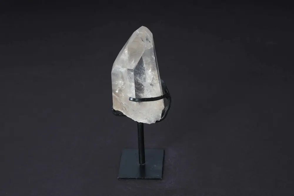 Semi-Polished Smoky Quartz Point on Stand, showcasing natural edges and polished faces for grounding and protection.