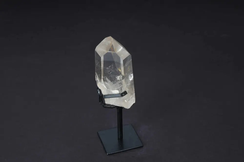 Semi-Polished Smoky Quartz Point on Stand, showcasing natural earthy tones and sleek design for grounding and protective energy.