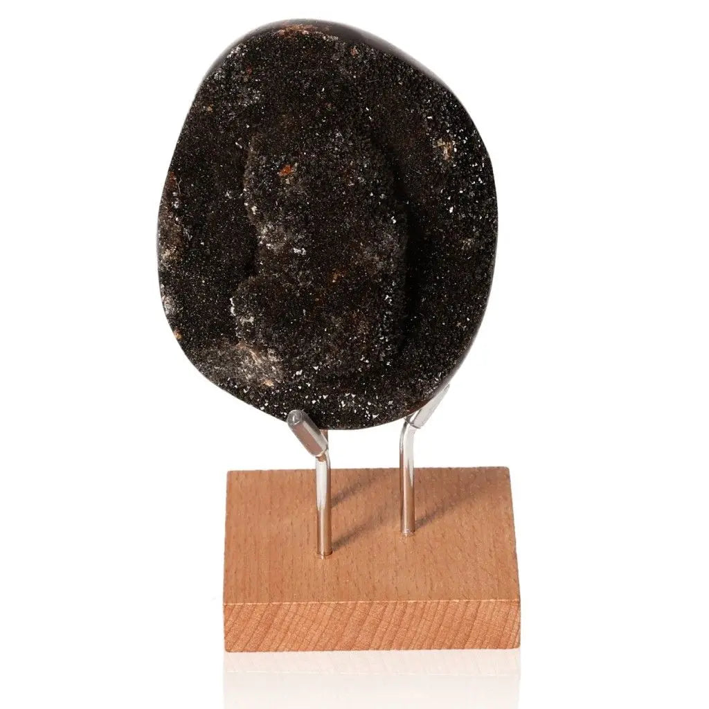 Unique septarian stone on wooden stand, showcasing its natural texture and multidimensional properties as the "Dragon Stone".