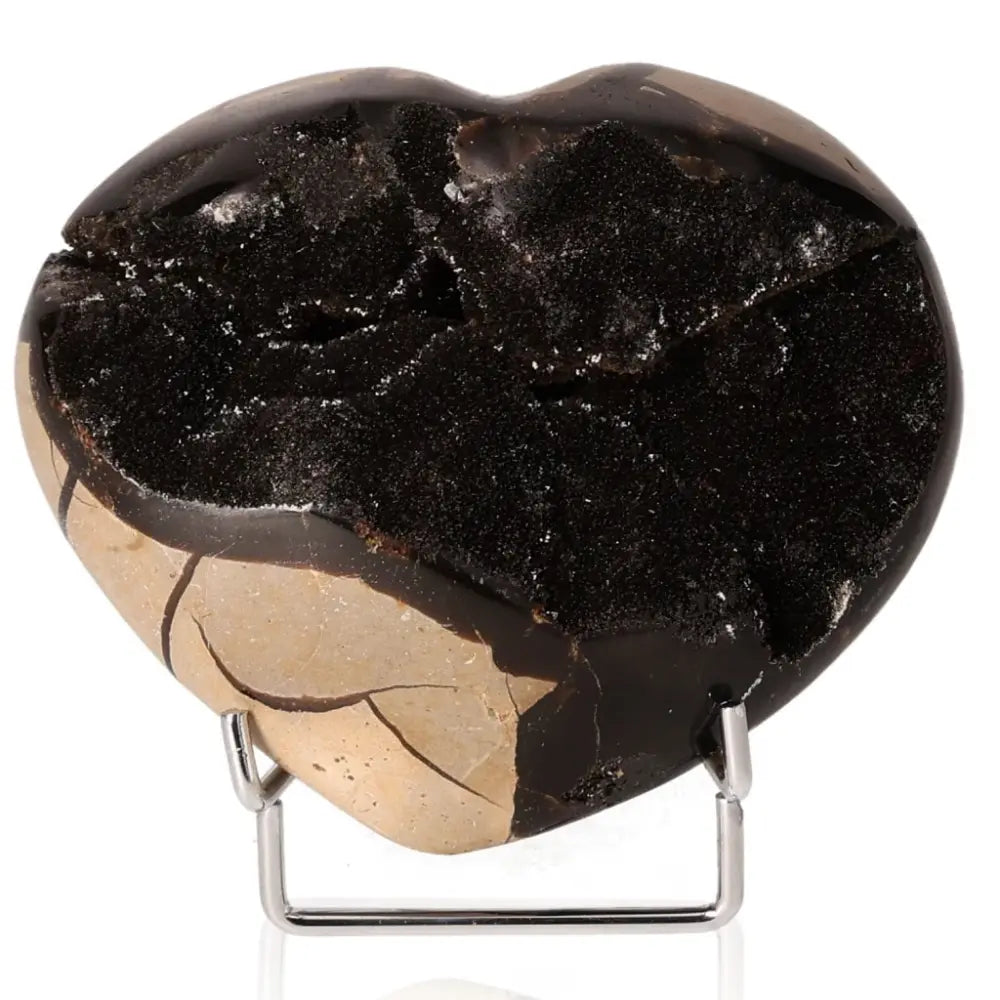 Heart-shaped polished Septarian "Dragon Stone" on stand, showcasing unique textures and patterns, symbolizing power and endurance.