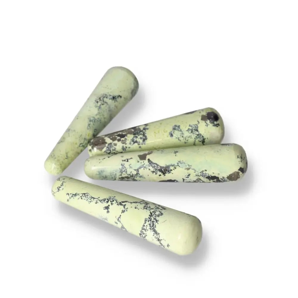 Collection of four Serpentine wands for meditation and spiritual healing, enhancing emotional balance and connection to nature.