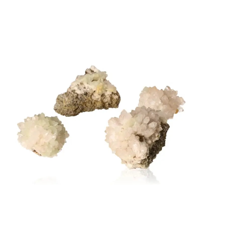 Small prehnite druzes with pale green to yellowish-green crystals, known for enhancing spiritual growth and inner peace.