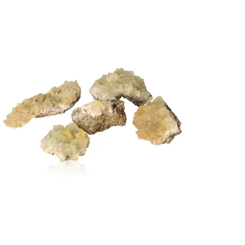 Small prehnite druzes, translucent pale green gemstones, known for their calming properties and enhancing spiritual growth.
