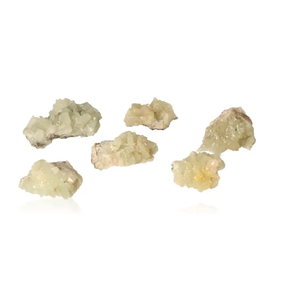 Small Prehnite Druzes in pale green shades promoting inner peace and spiritual growth on white background.