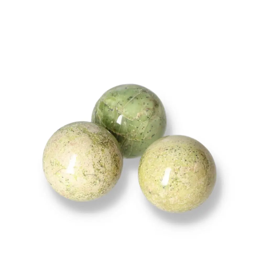 Polished small Serpentine spheres with vibrant green hues, ideal for meditation and grounding energy work.