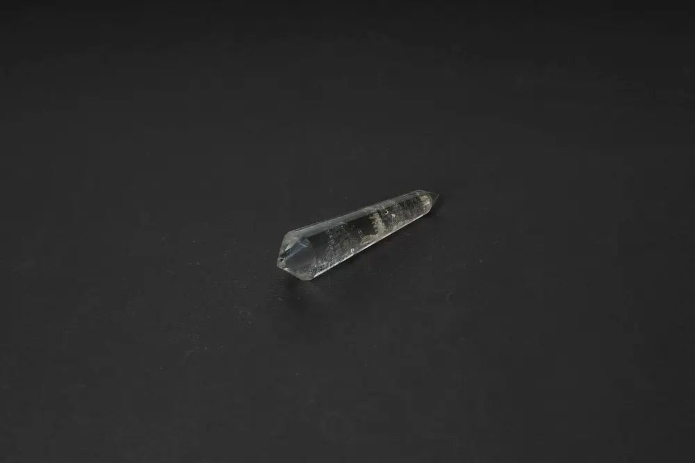 Smoky Quartz Point on black background, showcasing grounding and protective energies in its translucent, smoky hues.