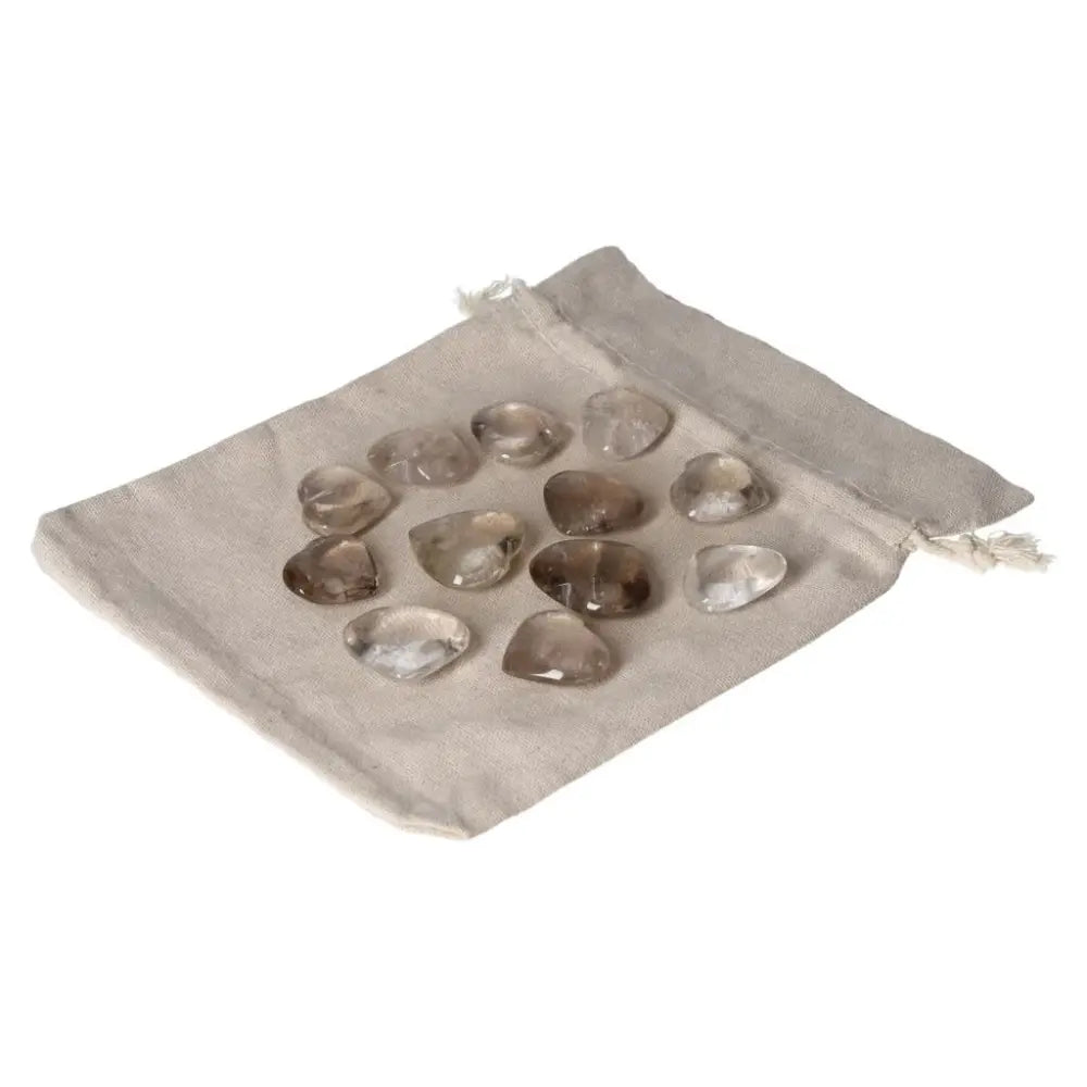 Smoky Quartz small heart stones on a fabric pouch, ideal for grounding and enhancing practical thinking.