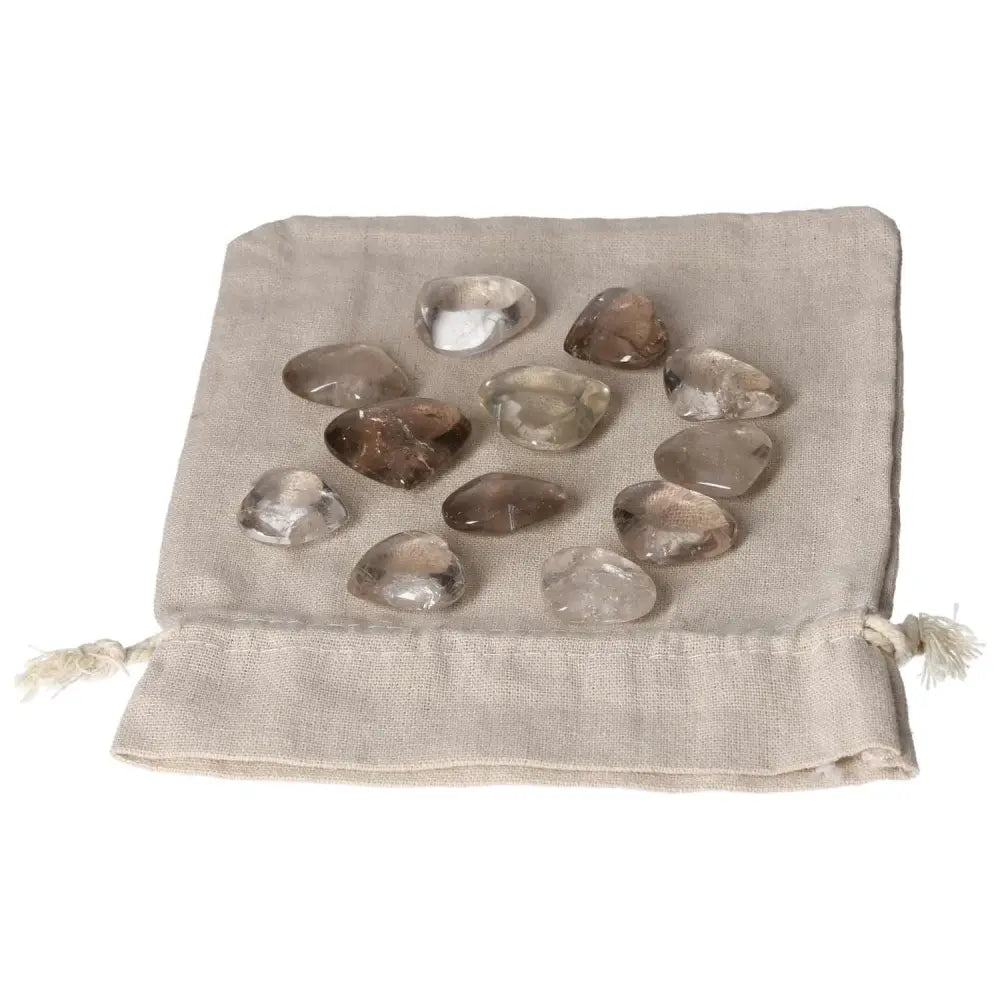 Smoky Quartz small heart stones on a beige pouch, ideal for grounding and decision support, perfect for business and responsible roles.