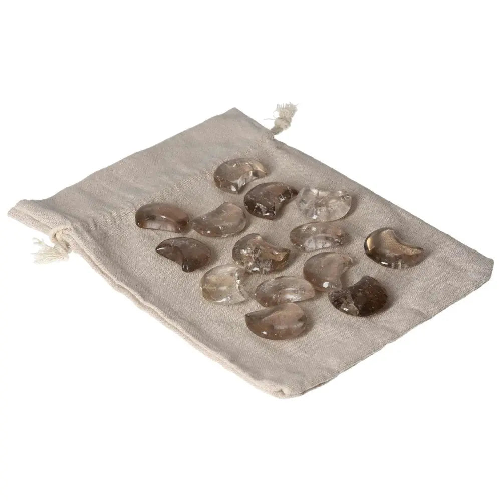 Smoky Quartz Small Moon stones on a cloth pouch, ideal for decision-making and grounding energy in business and personal life.