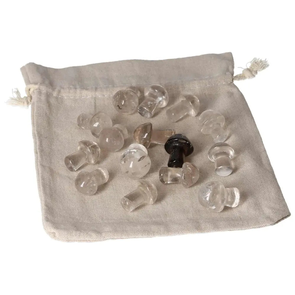 Collection of small smoky quartz mushroom stones on a beige pouch, ideal for grounding and practical decision-making.