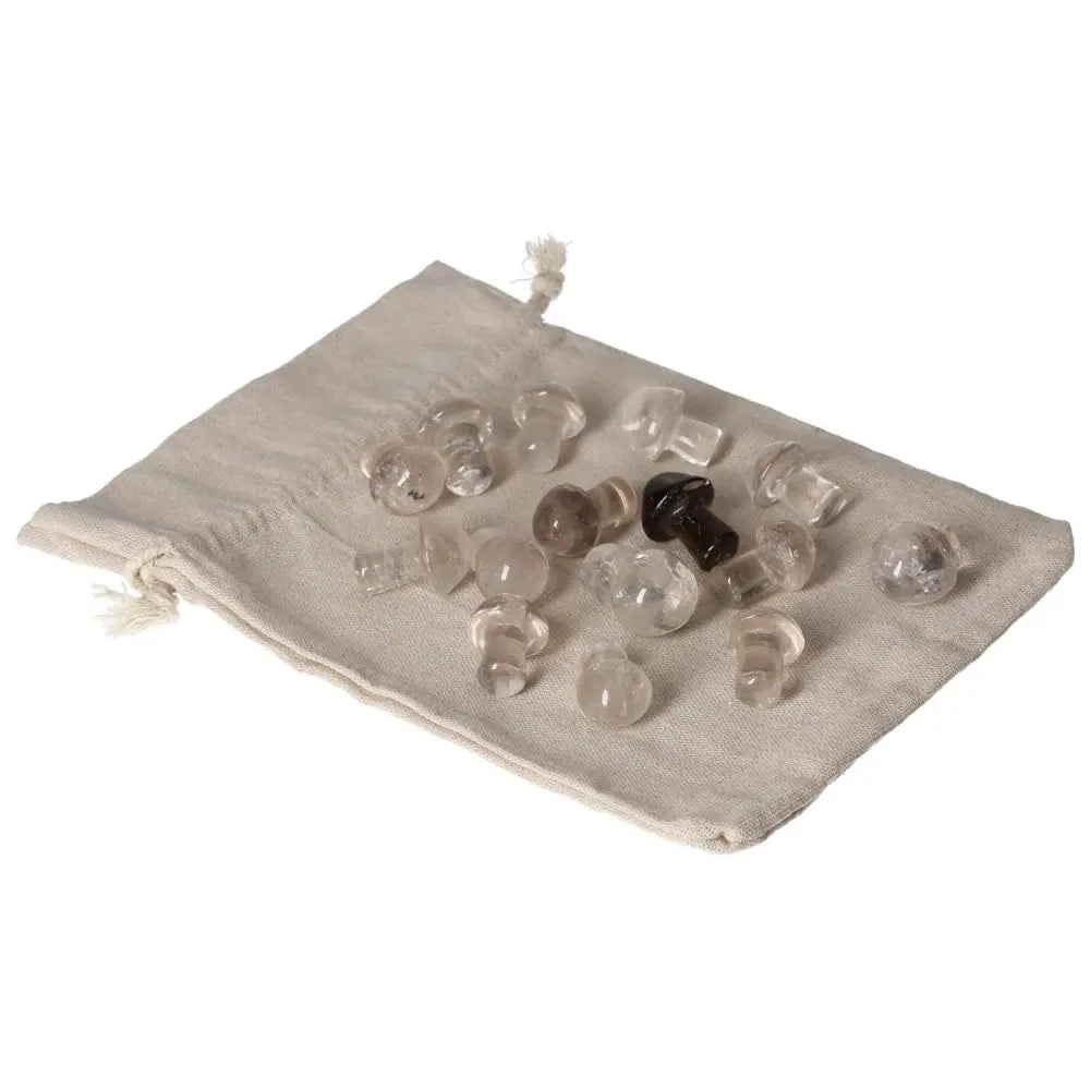 Smoky Quartz small mushroom stones on a beige cloth, ideal for grounding and enhancing practical thinking.