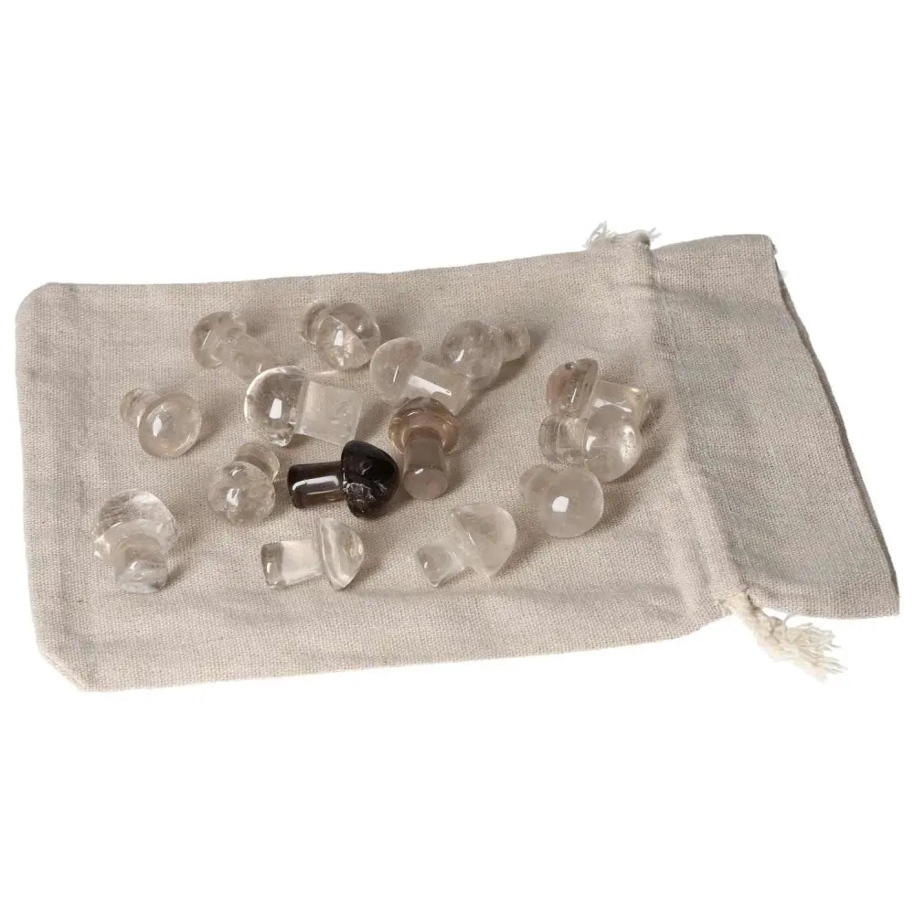 Collection of small smoky quartz mushroom stones on a linen bag, promoting clear thinking and decision-making for business professionals.