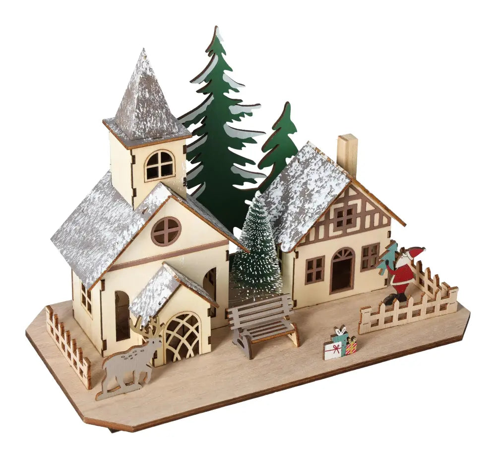 Table Deco Village House LED 27 cm with snow-dusted roofs and festive trees, enhancing home decor with ambient lighting.