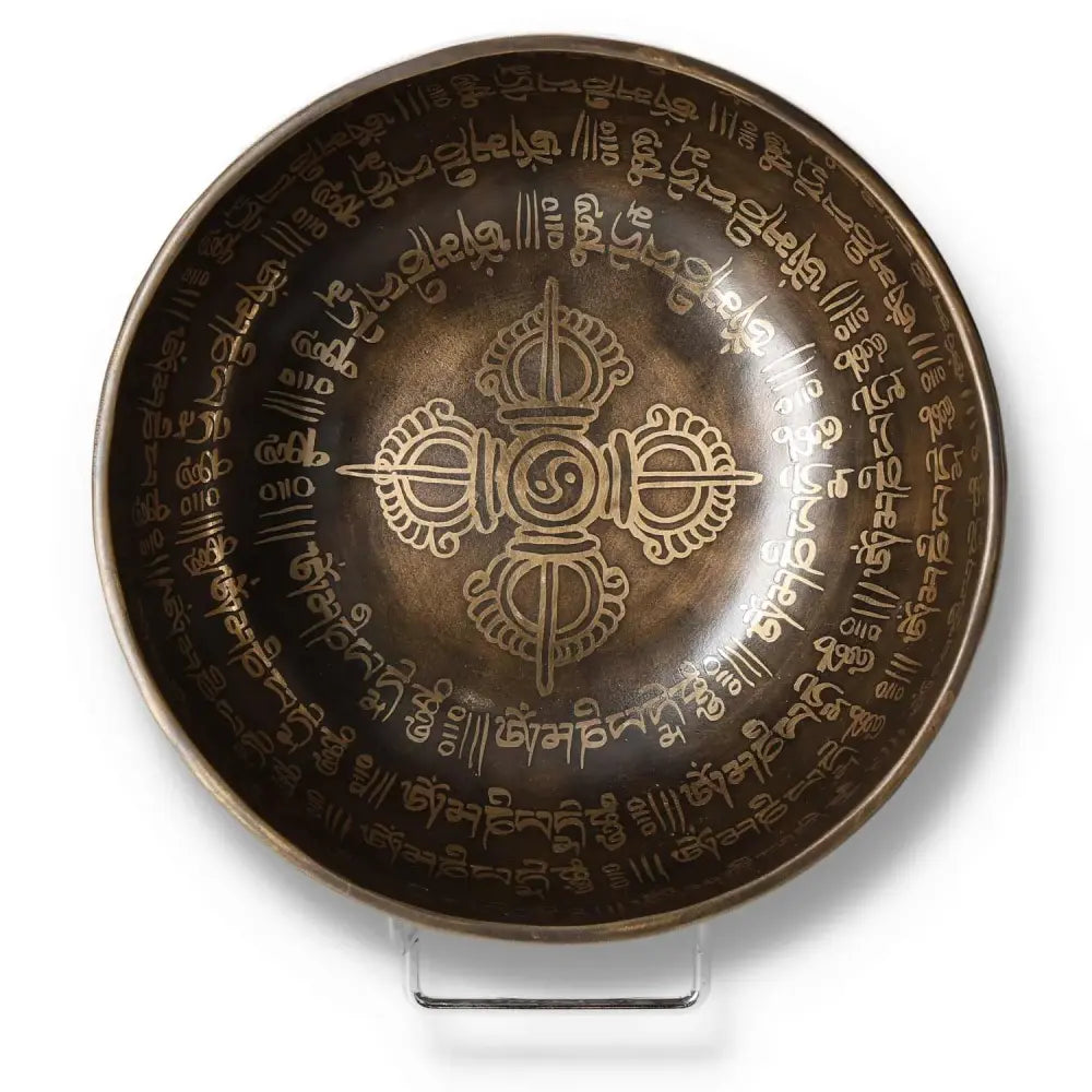 Tibetan healing bowl with engraved mantra, 16 cm size, showcasing intricate designs for meditation and spiritual practices.