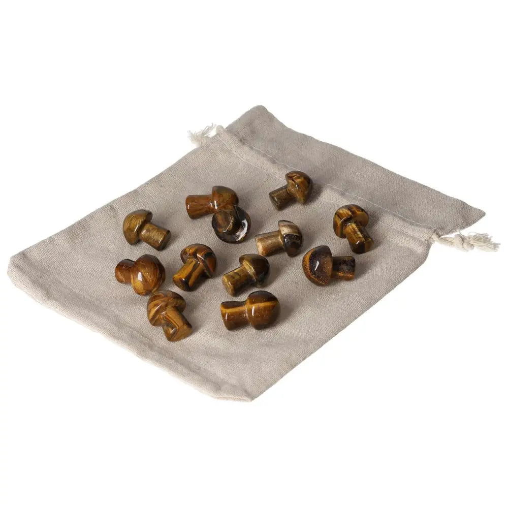 Tiger's Eye small mushrooms on a cloth pouch, enhancing focus, mental clarity, and bringing joy and stability.