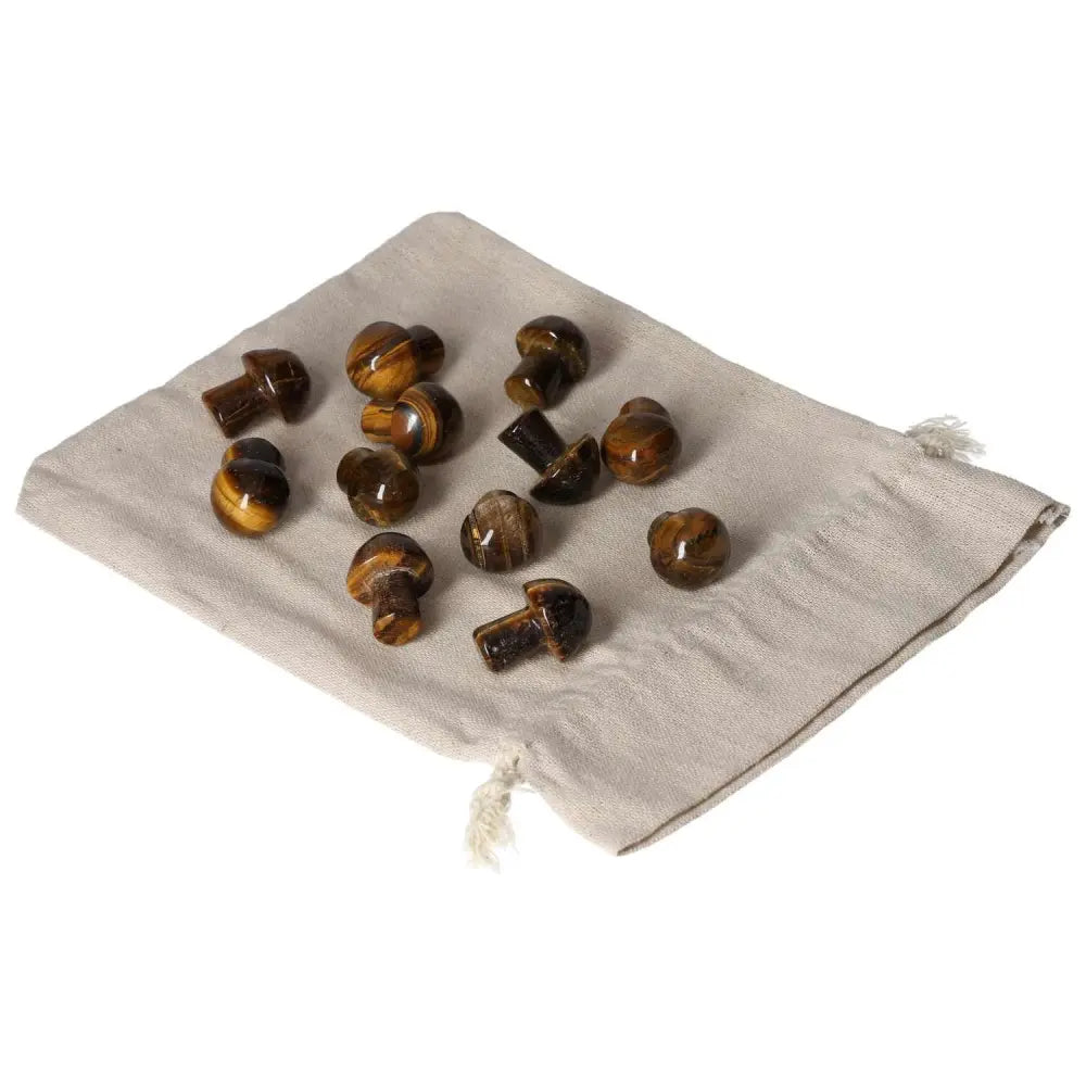 Tiger's Eye small mushroom stones on a linen pouch, promoting joy, mental clarity, and wealth management in metaphysical healing.
