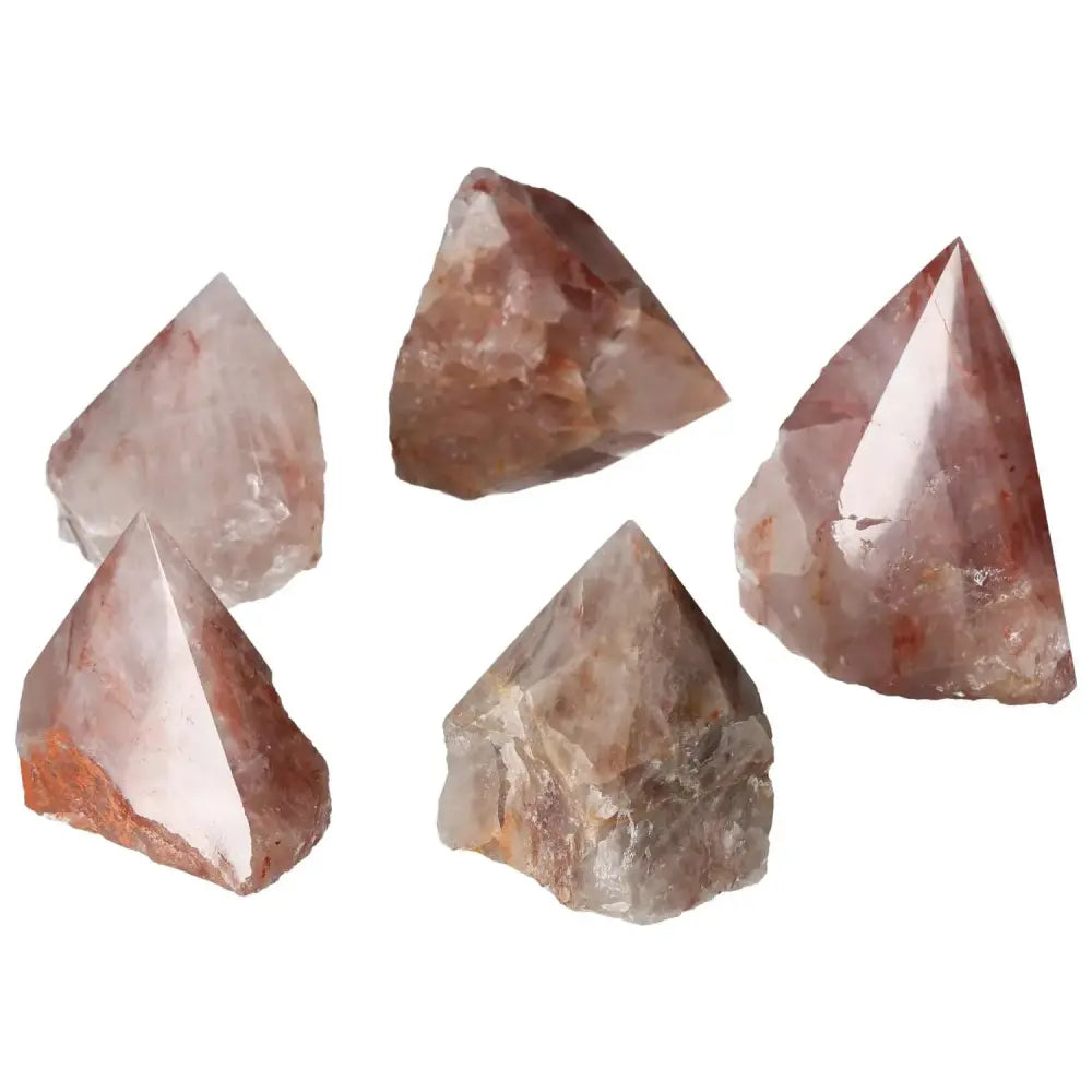 Collection of Top Polished Point Pink Hematoide Crystals by Sylvia Crystals, showcasing delicate pink hues for serenity and positive energy.