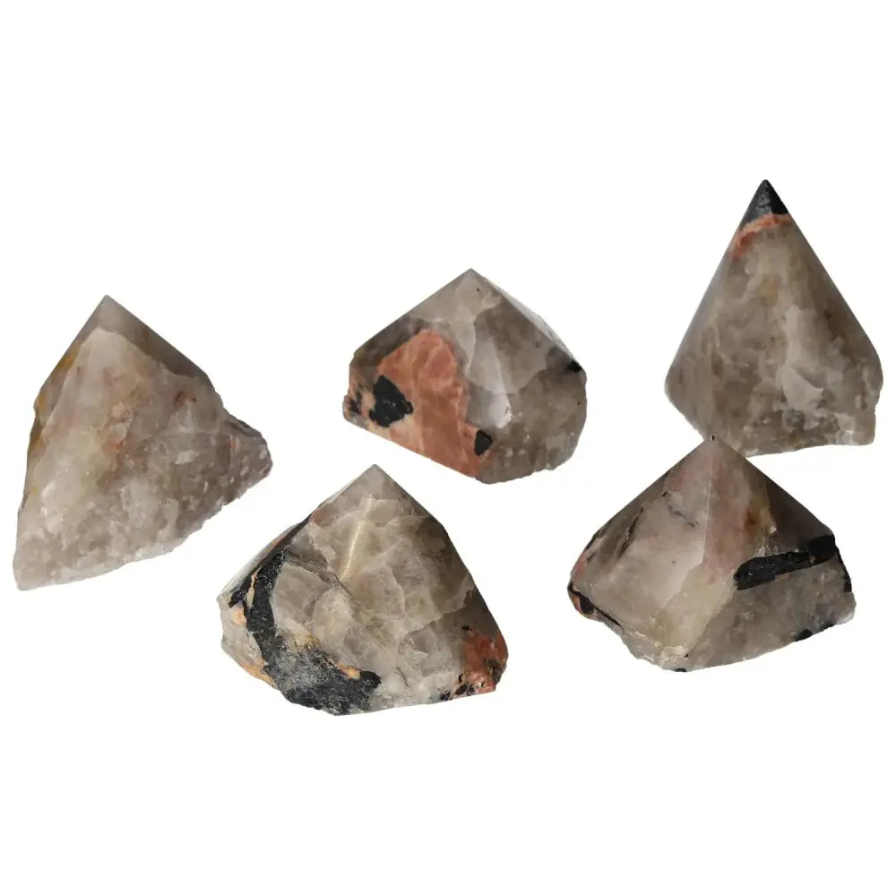 Collection of top polished point quartz crystals with black tourmaline inclusions, enhancing elegance and spiritual depth.