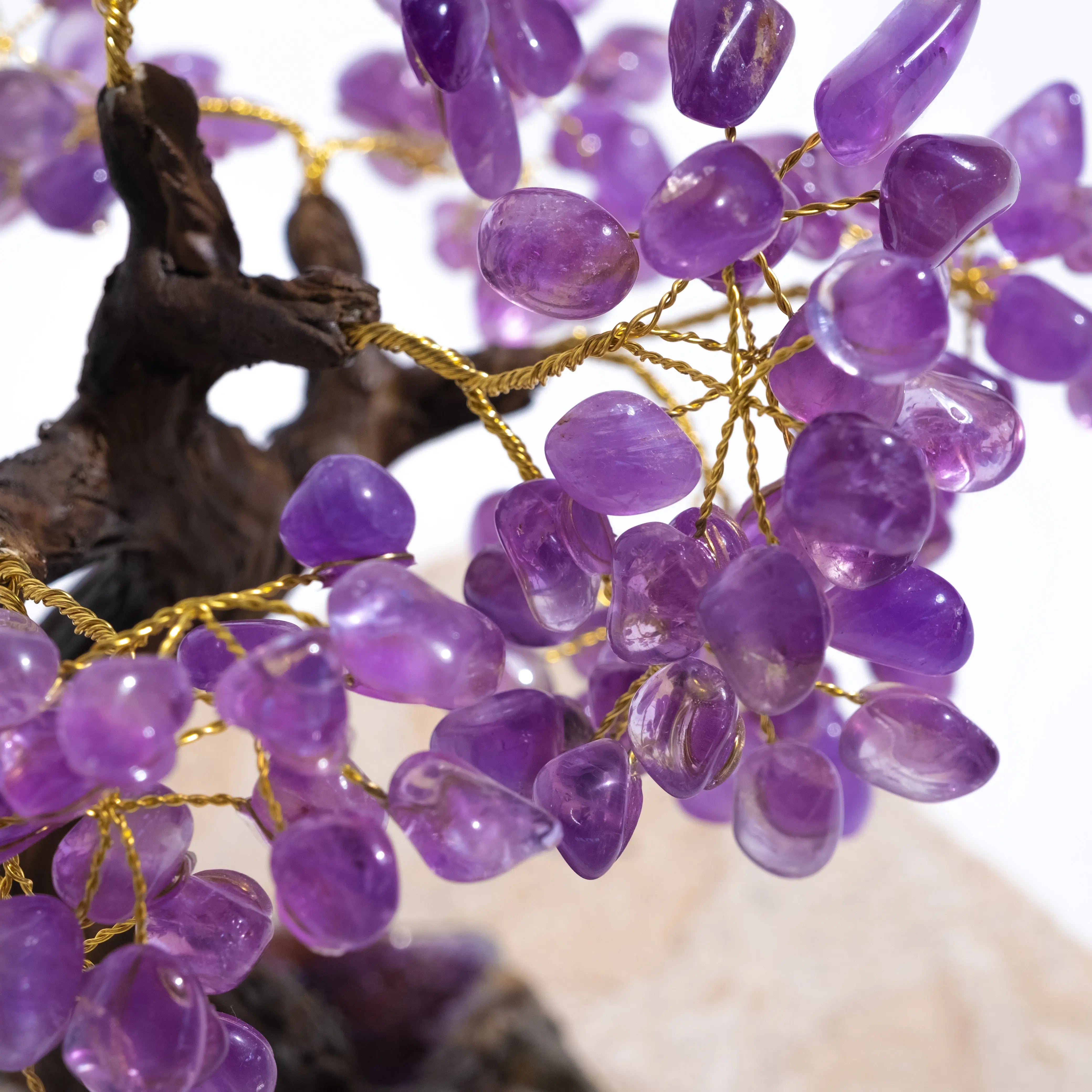 Close-up of tumbled amethyst crystal bonsai tree with gold wire branches, 40 cm, promoting calming energy and spiritual harmony.