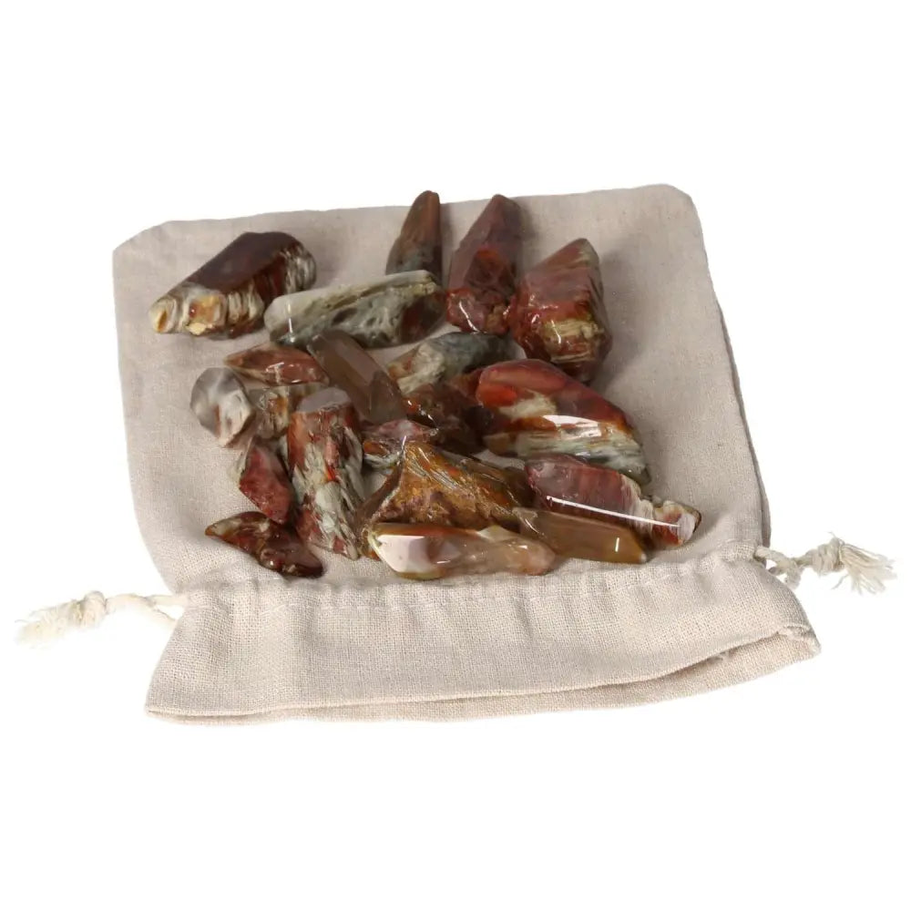 Alt Tag: Tumbled Amphibole crystals on a soft cloth, showcasing their spiritual allure and luxury from Sylvia Crystals collection.