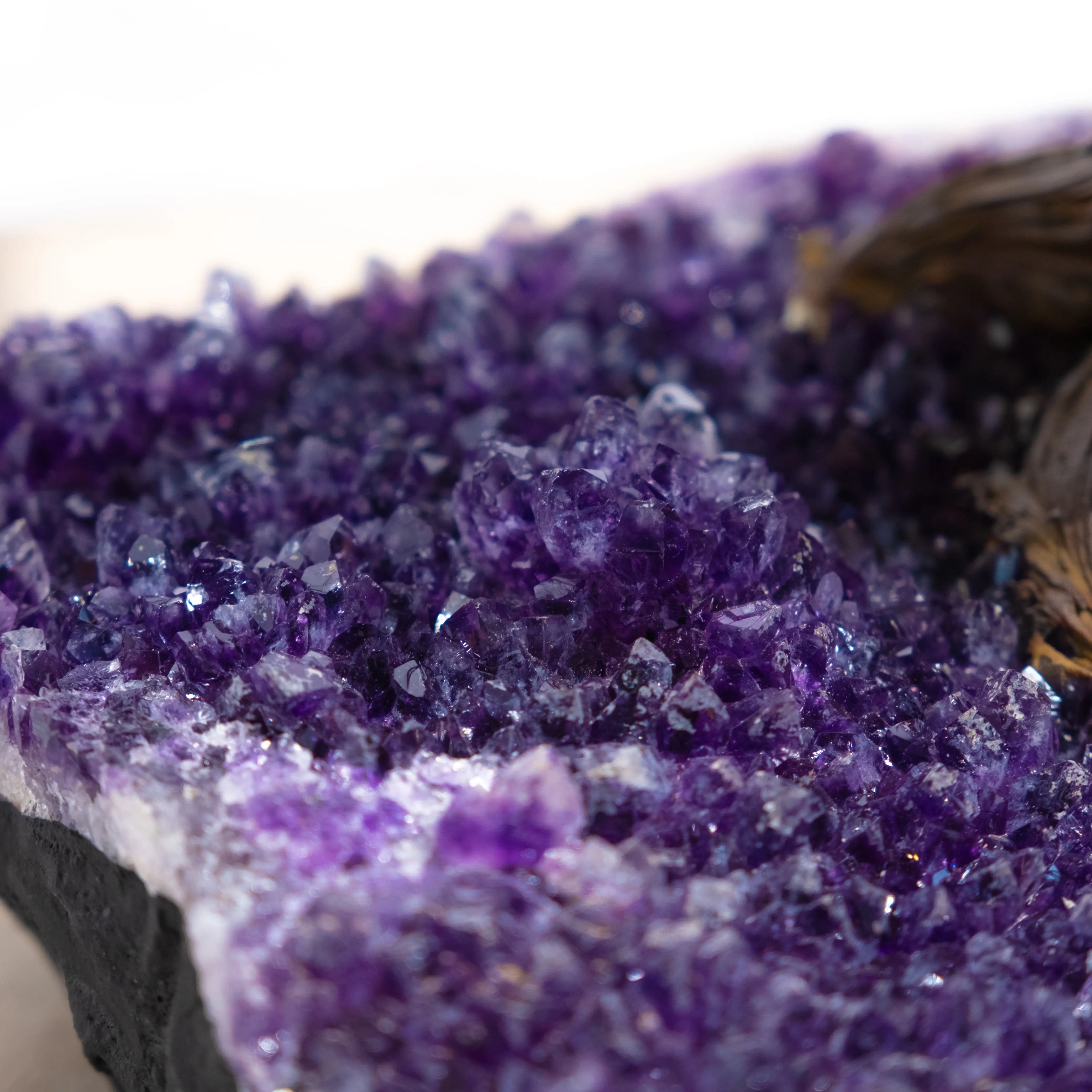 Close-up of amethyst crystal cluster showcasing vibrant purple hues and intricate formations.