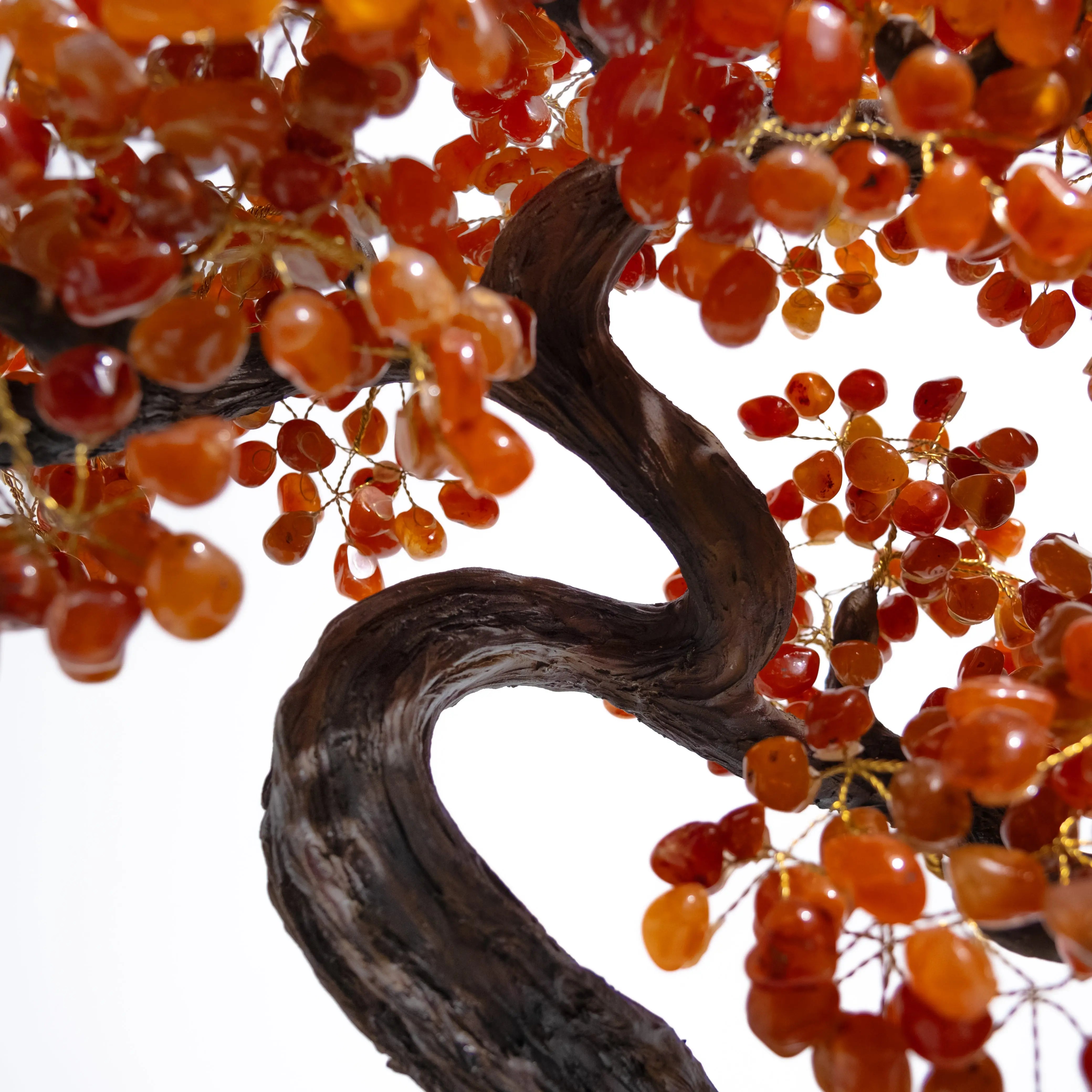 Close-up of a Tumbled Carnelian Bonsai Tree with orange gemstones, symbolizing confidence, creativity, and positive energy.
