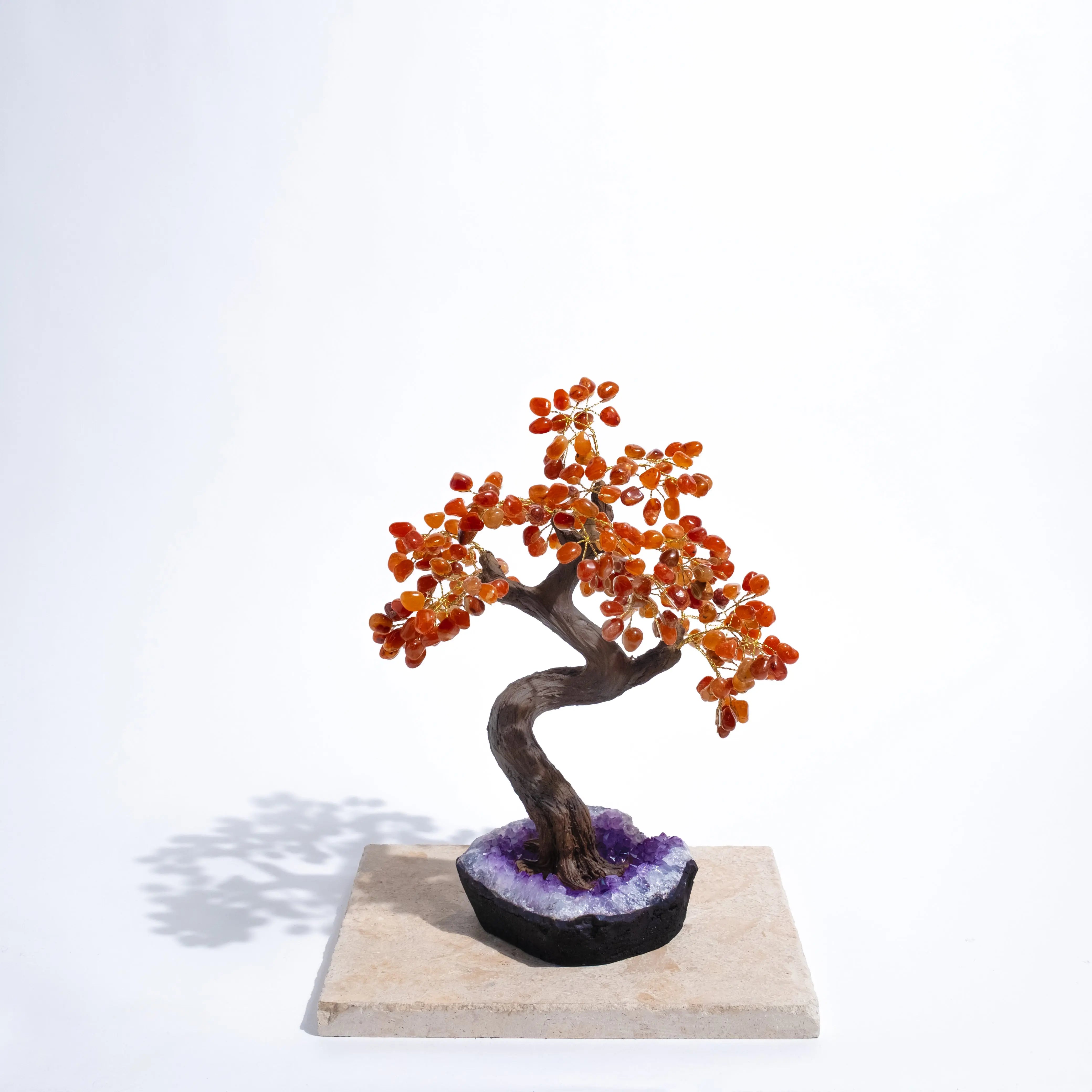 Handcrafted Tumbled Carnelian Bonsai Tree with polished gemstones, enhancing creativity and positive energy, on white background.