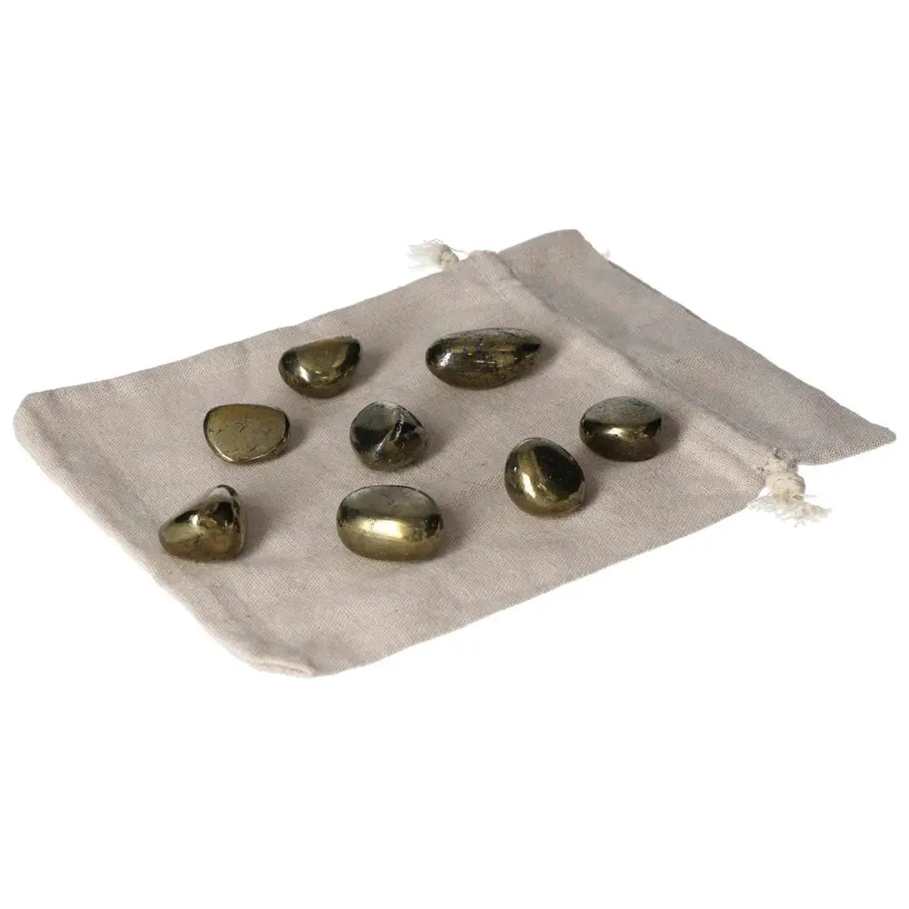 Tumbled Chalcopyrite stones on cloth pouch, known for stress relief, boosting self-confidence, and enhancing psychic abilities.