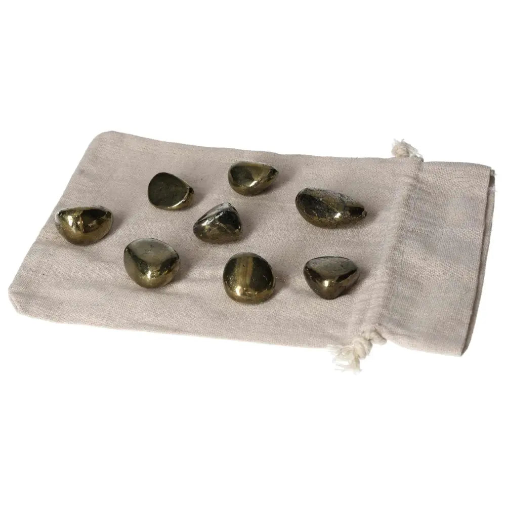 Tumbled Chalcopyrite stones on a fabric pouch, known for stress relief, boosting confidence, and enhancing psychic abilities.