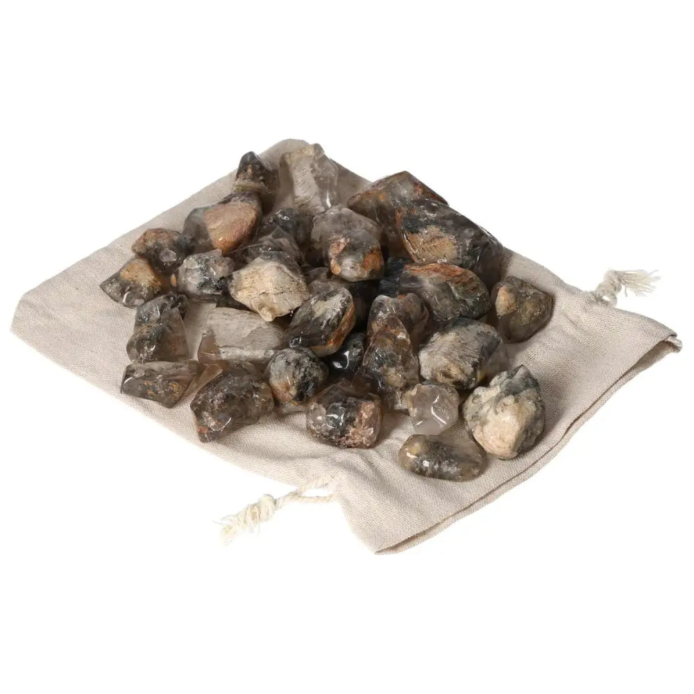 Tumbled Lodolite gemstones on a cloth bag from Sylvia Crystals, showcasing premium quality, elegance, and spiritual enhancement.