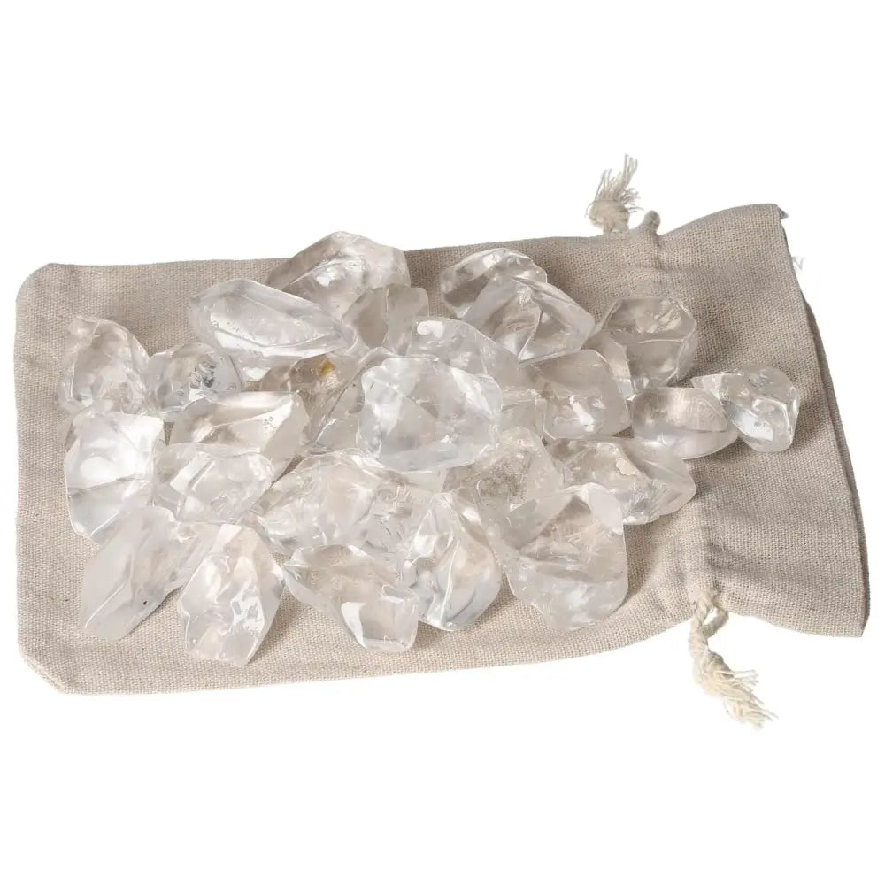 Tumbled Quartz Ice Cubes on a beige fabric bag, representing elegance and spirituality from Sylvia Crystals.