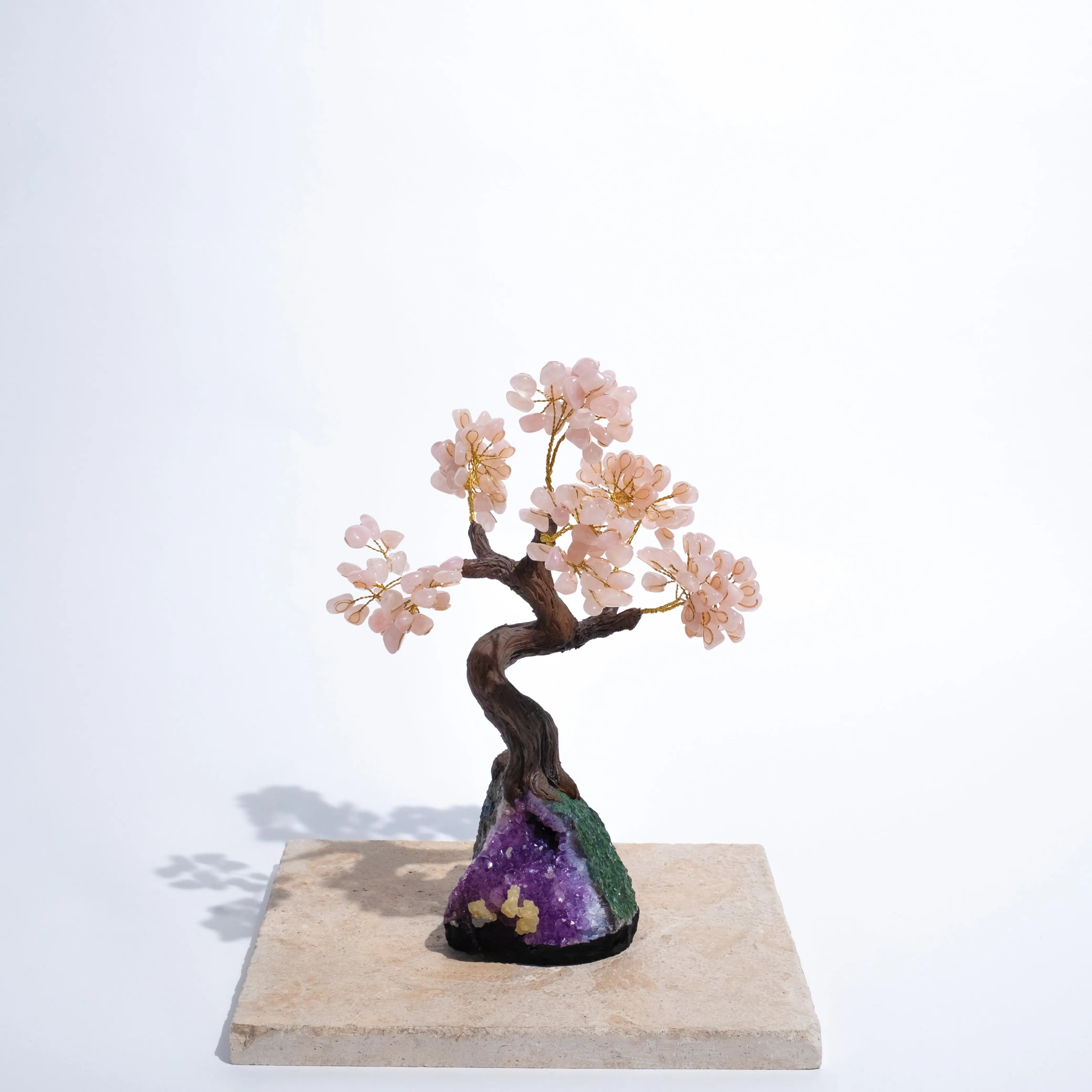 Elegant tumbled rose quartz tree 40cm on a stone base, symbolizing prosperity and positive energy with delicate pink gemstones.