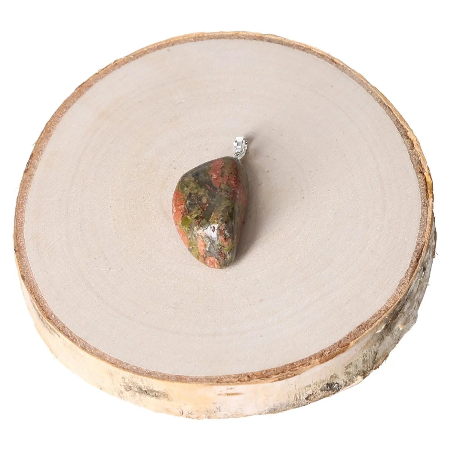Unakite Tumbled Pendant with olive green and pink tones, displayed on a wooden slice, highlighting its smooth finish and natural patterns.