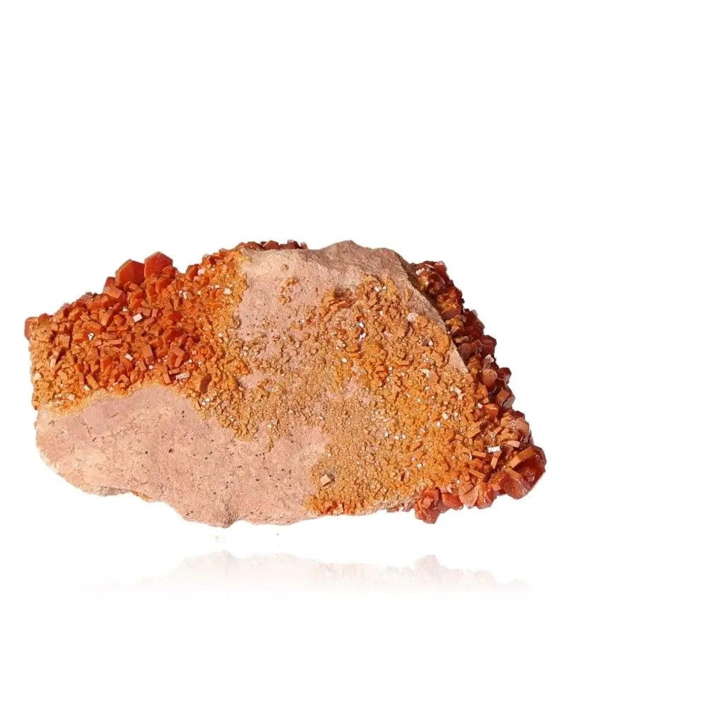 Vanadinite Druze mineral, showcasing vibrant red-orange crystals for focus, creativity, and energy