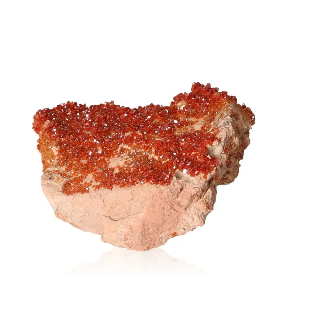 Vanadinite druze crystal with vibrant red-orange hues, known for its focus-enhancing properties. Ideal for collectors and creatives.