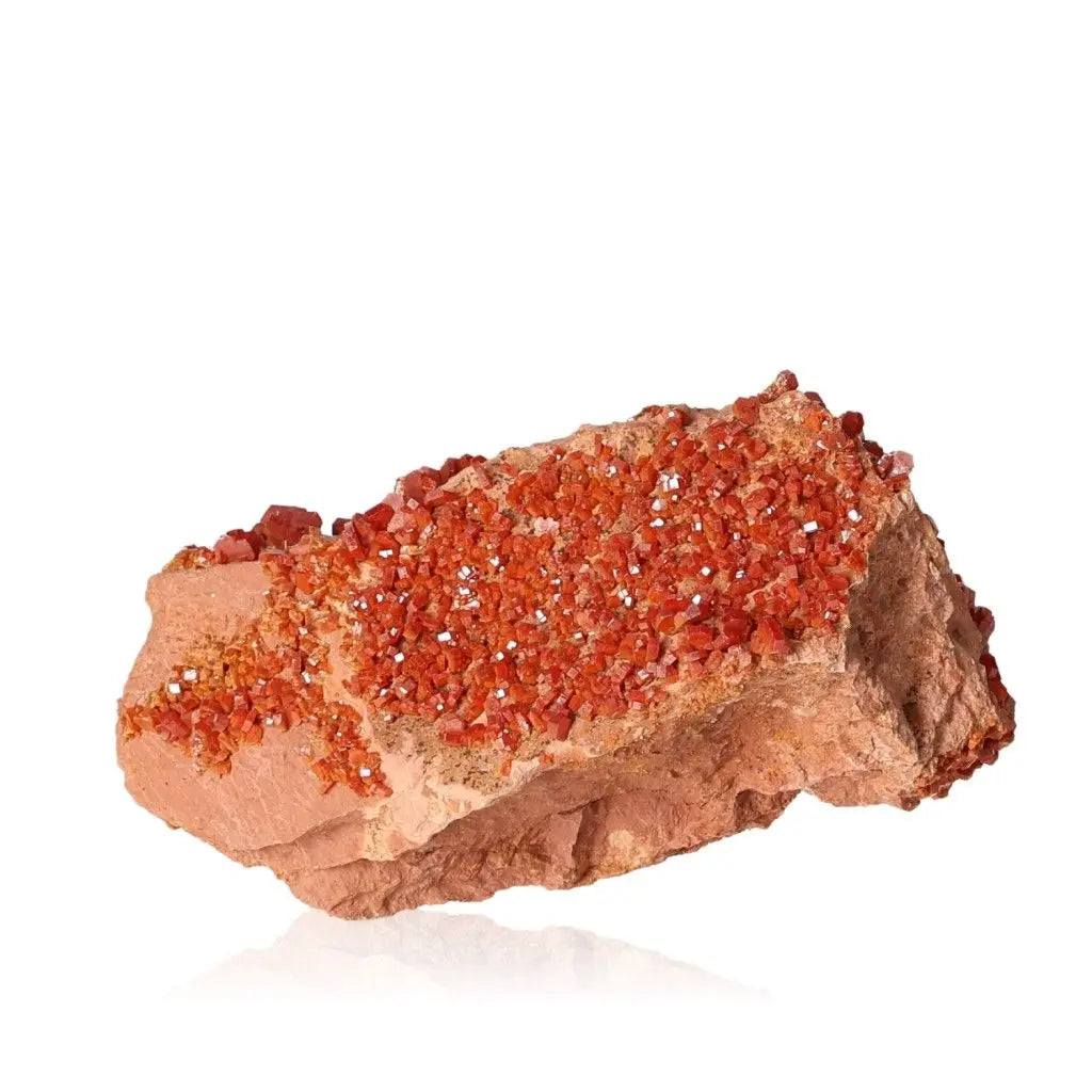 Vanadinite Druze mineral displaying vibrant red-orange crystal formations, ideal for enhancing focus and creativity.