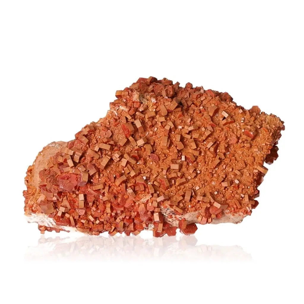 Vanadinite Druze mineral with vibrant red-orange hues, ideal for collectors and creatives seeking focus and energy. Stone of creativity.