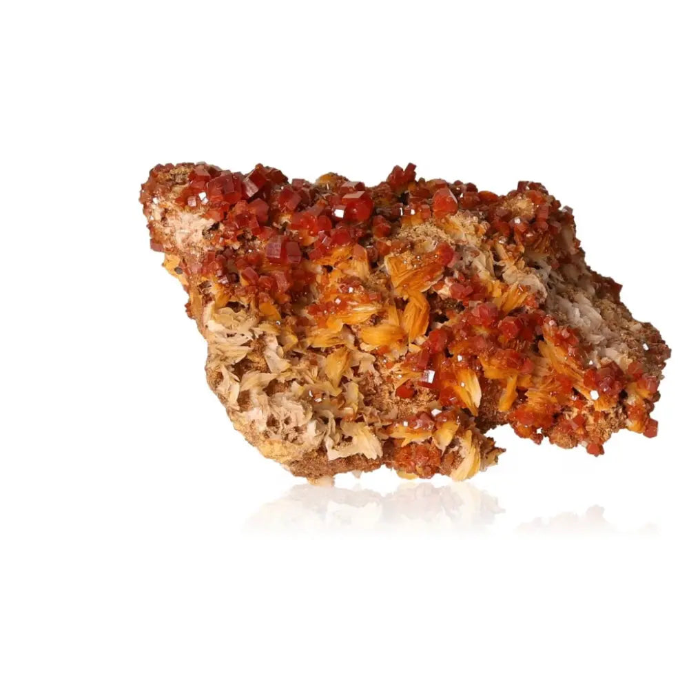 Vibrant Vanadinite druze showcasing red-orange hues and intricate crystal formations, ideal for focus, creativity, and collecting.