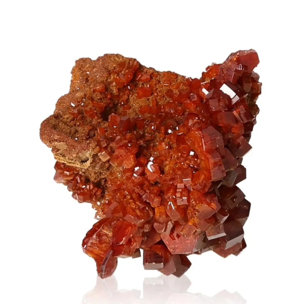 Vibrant red-orange vanadinite druze crystal formation showcasing unique structures for collectors and creatives seeking focus.