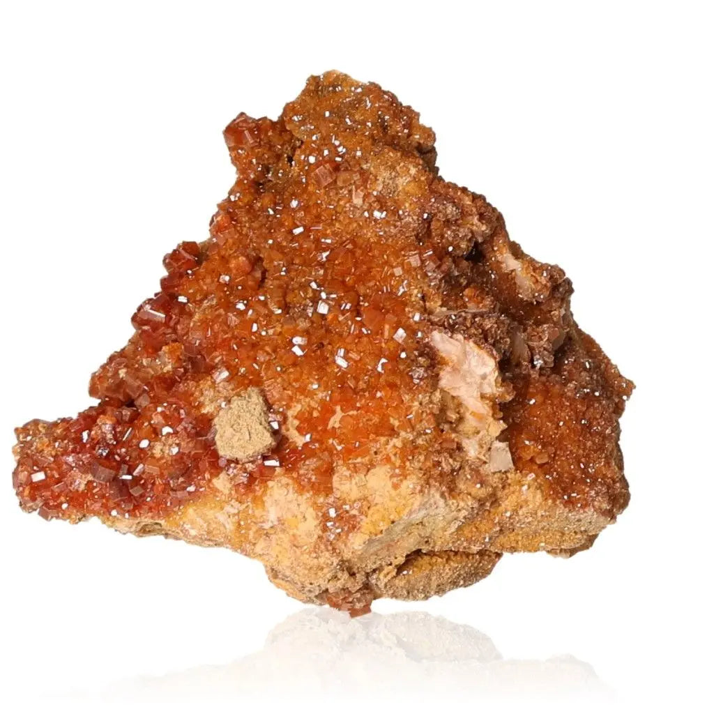 Vanadinite Druze with vibrant red-orange crystals, showcasing unique formations, known for enhancing focus and creativity.