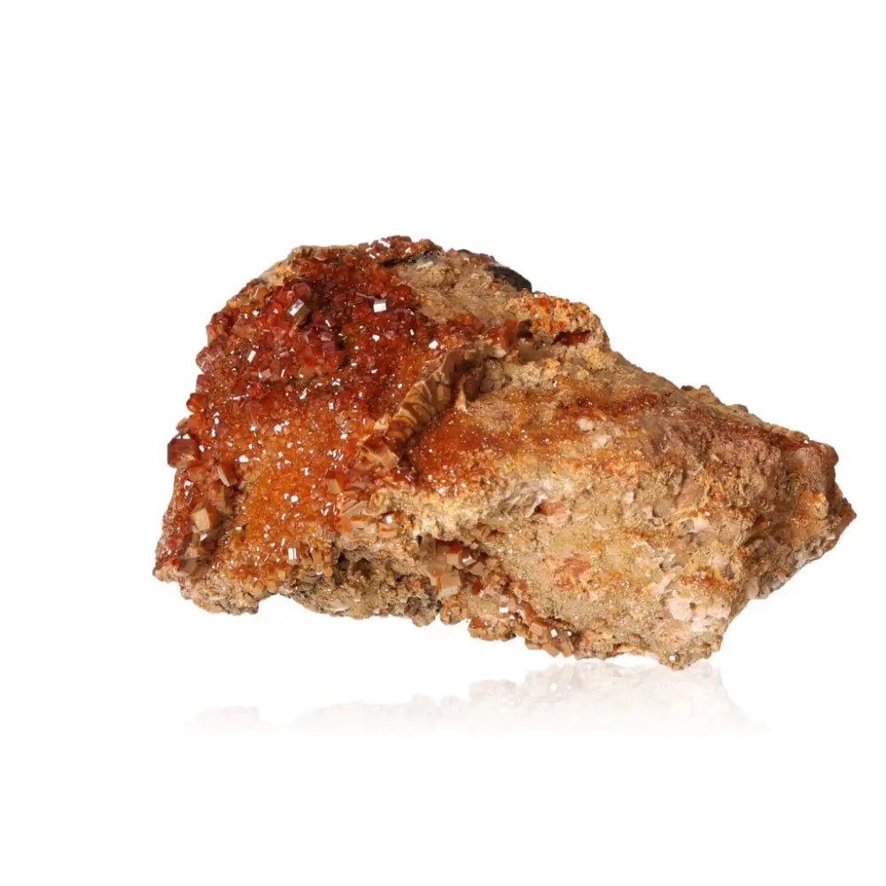 Vibrant Vanadinite Druze showcasing fiery red-orange crystal formations, perfect for enhancing creativity and focus.