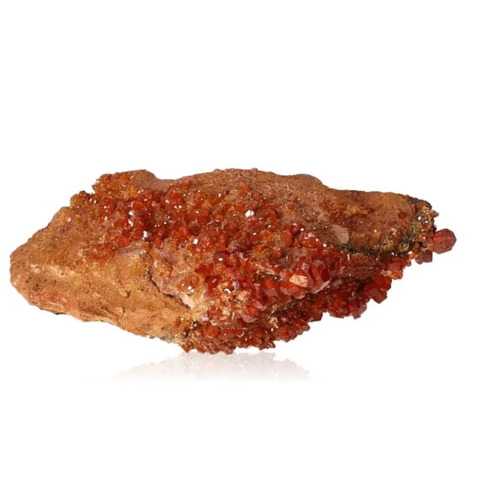 Vanadinite Druze mineral showcasing vibrant red-orange hues and unique crystal formations, ideal for enhancing focus and creativity.