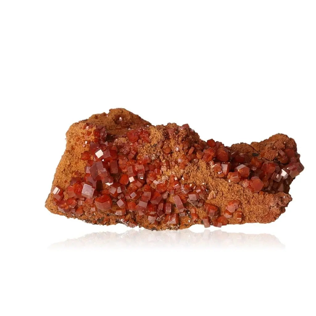 Vanadinite Druze showcasing vibrant red-orange crystals, ideal for collectors and creatives seeking focus, energy, and grounding.